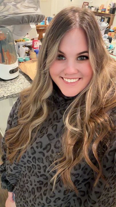 Customer Sam wearing a black leopard Comfrt hoodie